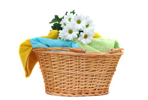 laundry basket with colorful towels and flowers