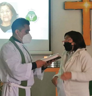 Lidia with Pastor Walterson as Lidia publicly confessed her faith and joined the Lutheran church.